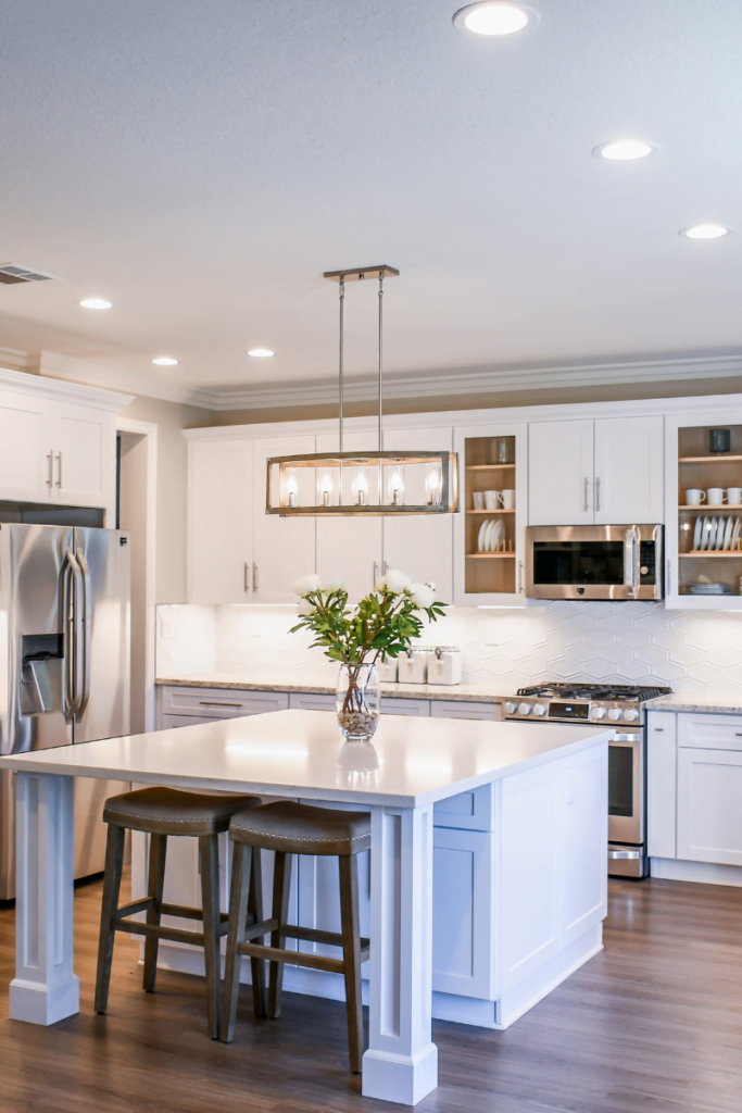 A kitchen with wooden floors.