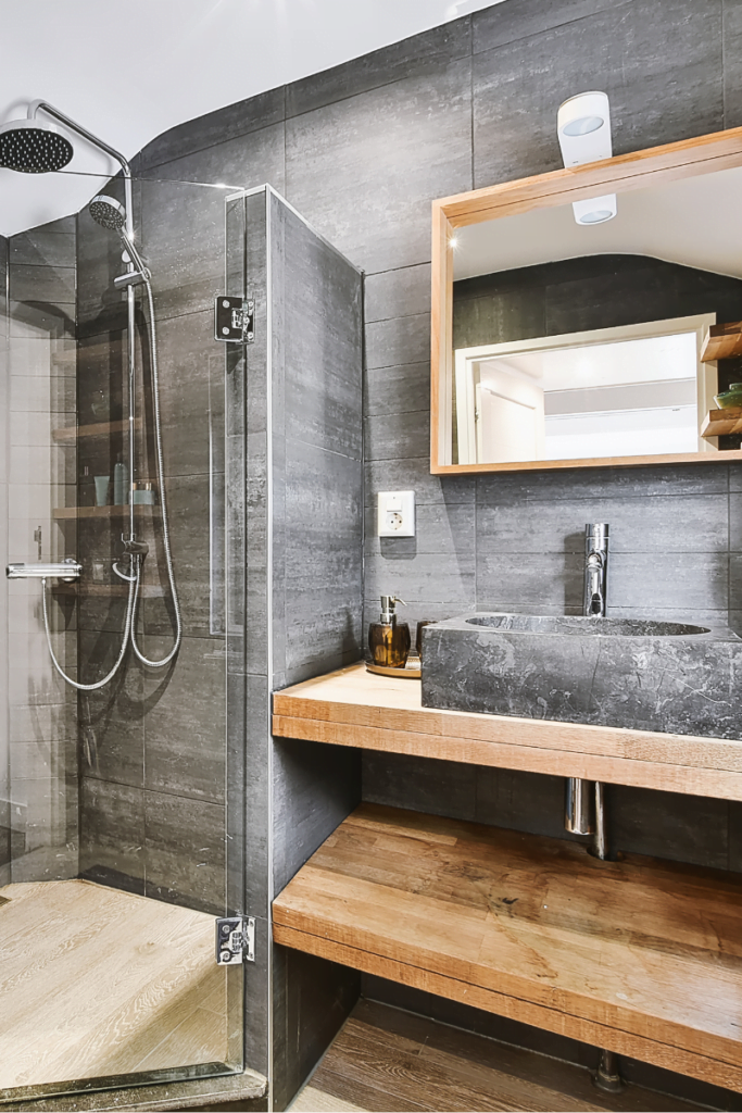 A modern bathroom with a glass shower stall available through Atlanta Remodeling Services.