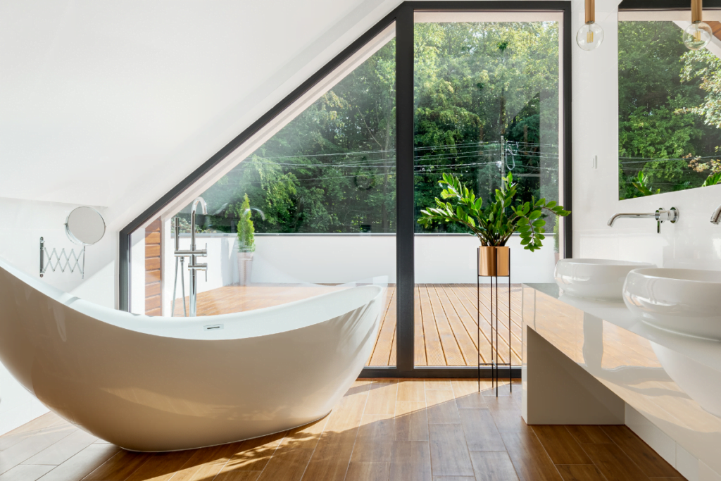 A bathroom upgrade featuring a white bathtub and a window, adding value to the space.