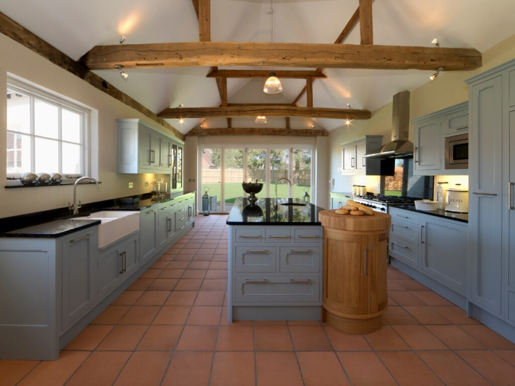 A wooden beam in the colonial style kitchen ceiling.