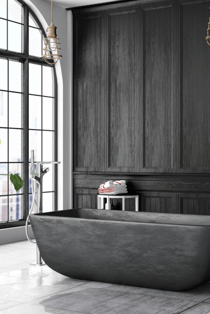 Woodstock Remodeling Services 5 A black and white bathroom with a large tub renovated by Woodstock Remodeling Services.