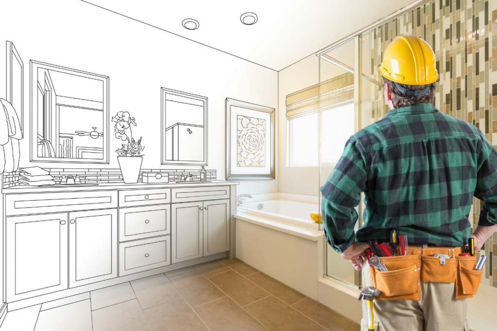 Atlanta remodeling contractors with tools planning a bathroom renovation.