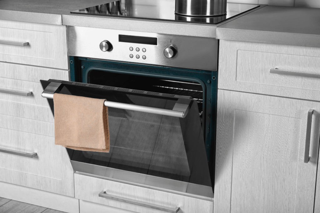 An oven with a towel from it, enhancing the ROI of a kitchen remodel.