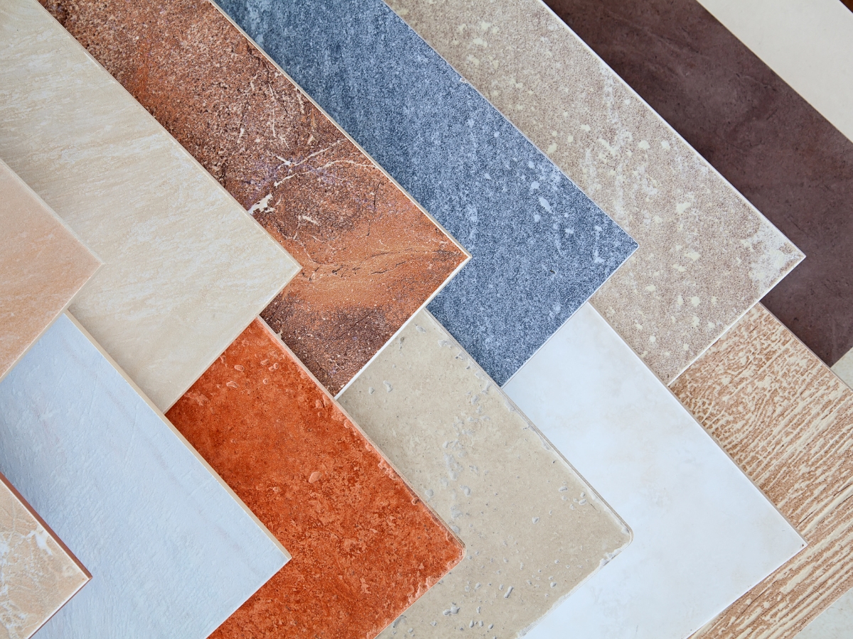 Bathroom Remodeling Trends in Atlanta-Midtown: Top Design Ideas for 2025 3 Rectangular ceramic tiles in various colors and textures are arranged in an overlapping, diagonal pattern—a stylish choice inspired by the latest bathroom remodeling trends.