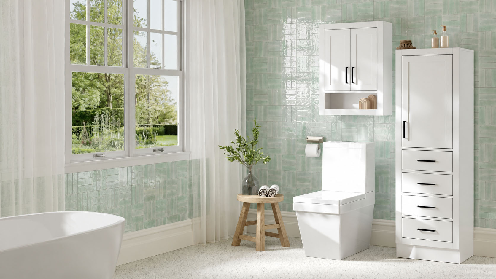 Bathroom with a bathtub, window, white bathroom cabinets from ARIEL bath vanities and storage, stool with vase and towels, toilet, and light green tiled walls; natural light entering from the window.
