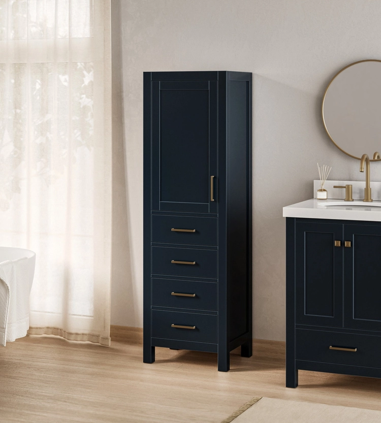 Tall navy blue ARIEL bath vanities and storage cabinet with four drawers and a door, next to a matching vanity with a round mirror in a modern bathroom with light wood floors.